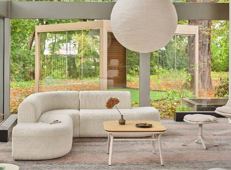 Elegant modern lounge furniture in a contemporary interior featuring designer seating, natural lighting, and minimalist styling.